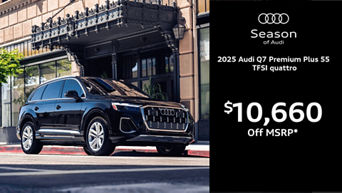 Audi Q7 parked by a building