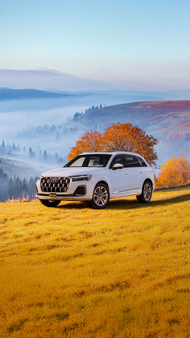Audi Q7 driving through mountain road in Maine