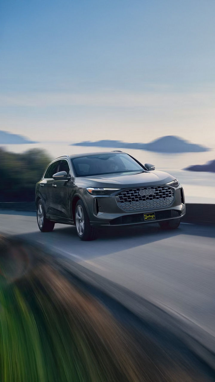 Audi Q5 driving through mountain road in Maine