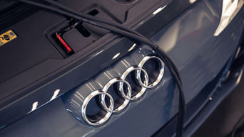 Audi rings on the back of a vehicle.