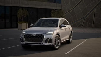 Three quarter profile view of an Audi Q5 accelerating.