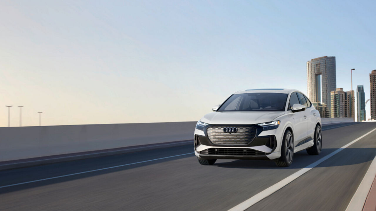 2025 Aud Q4 Sportback e-tron Exterior Driving Away From City