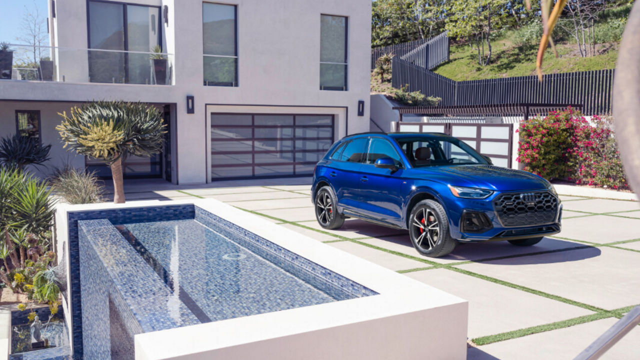 2025 Audi Q5 Exterior Parked In Driveway By House With Waterfall