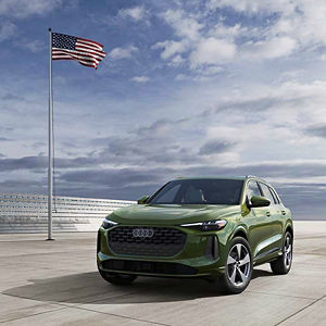 Side view of an Audi vehicle parked.