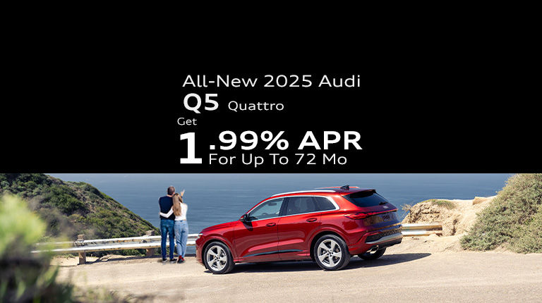 Left side profile view of an Audi Q5 parked.