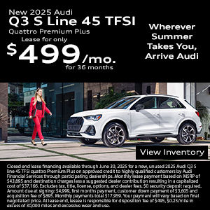 Side view of an Audi Q3 driving.