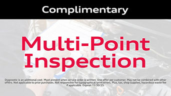 Service technician servicing vehicle. 