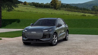 Left side profile of an Audi Q6 e-tron parked.