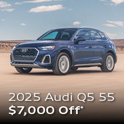 Three quarter profile view of an Audi Q5 parked.