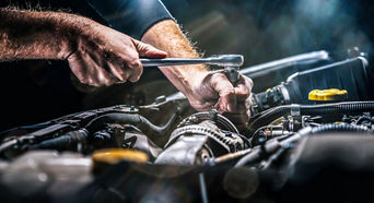 Service technician servicing air filter.