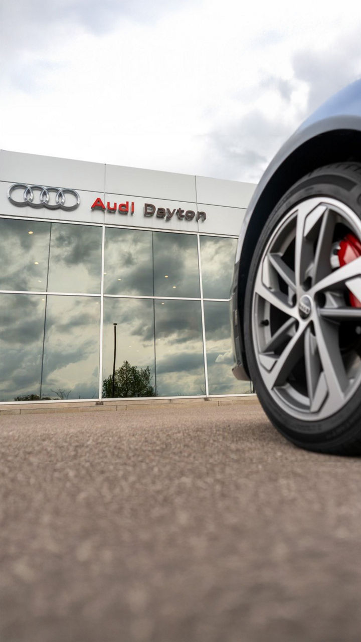 Left side profile view of an Audi S6 parked.