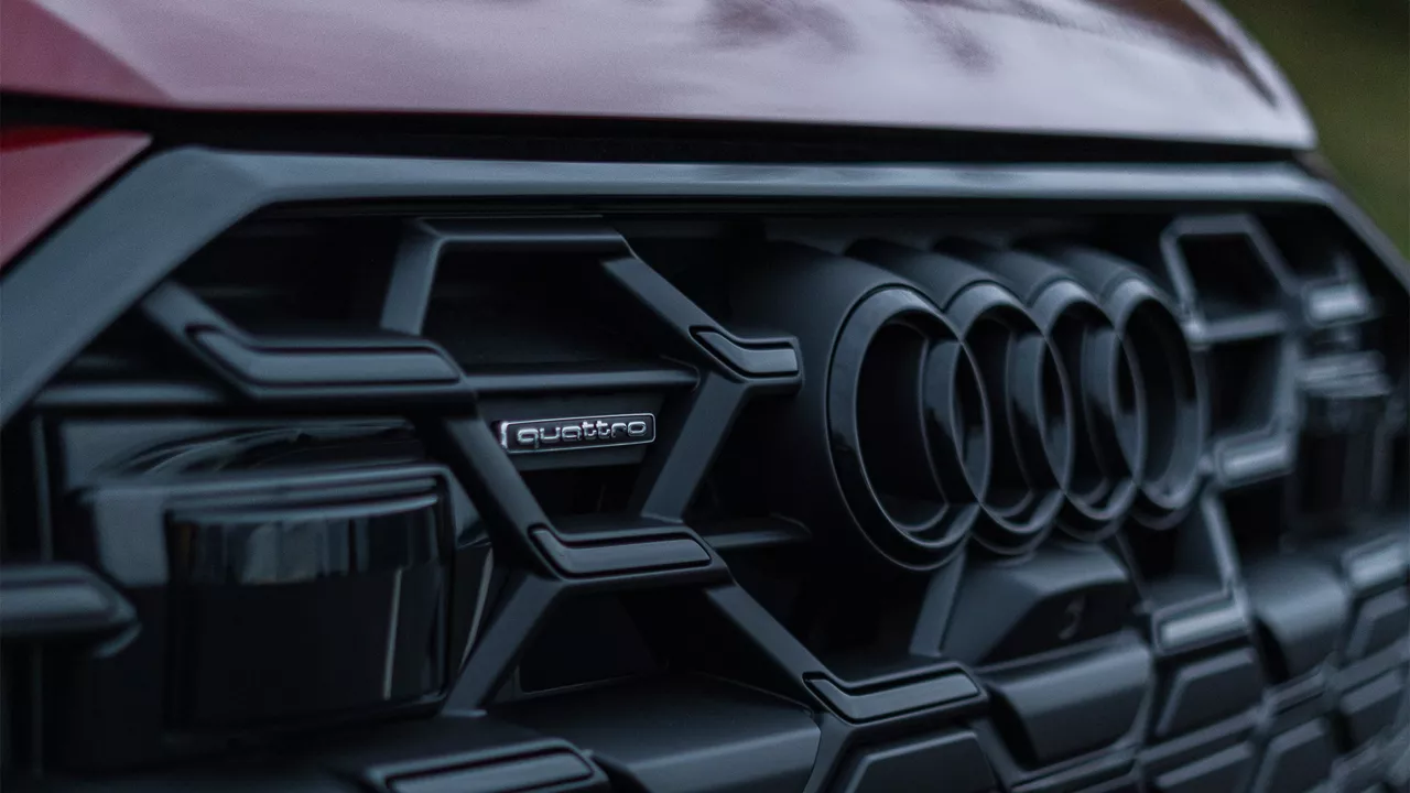 Left profile view of an Audi q8 vehicle parked.