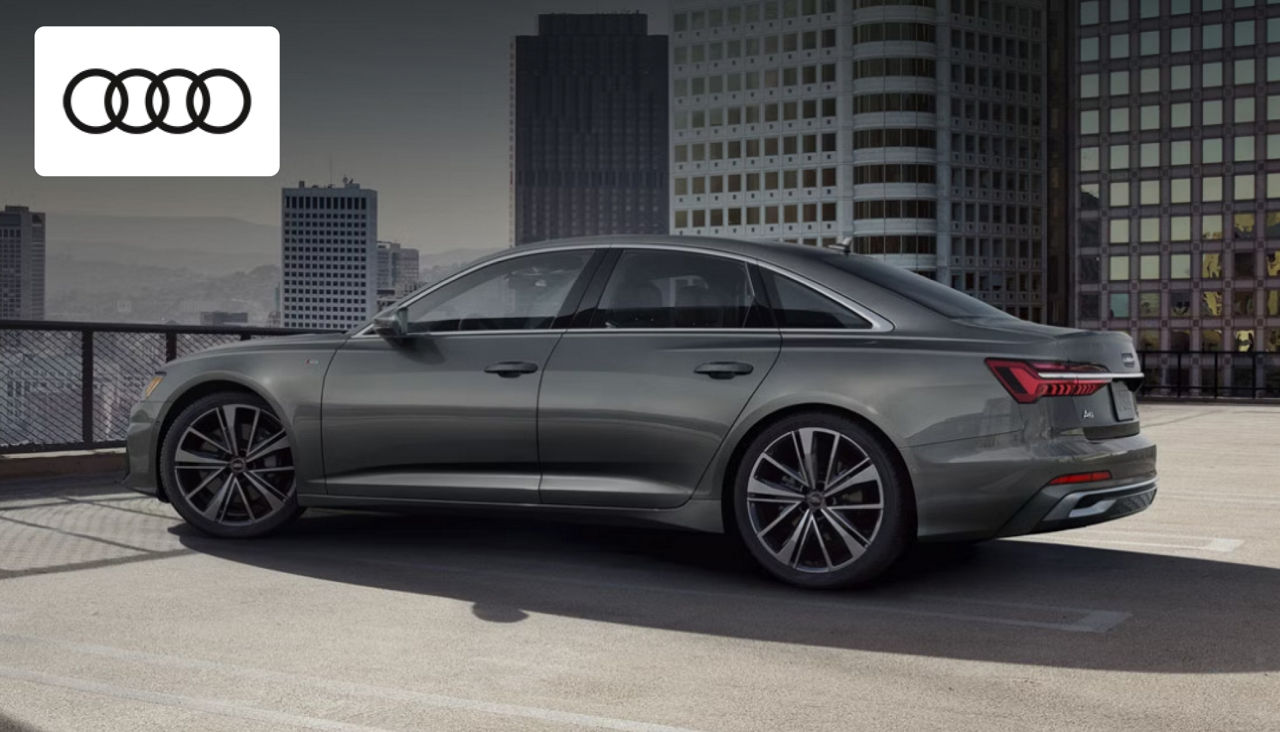 Audi A6 luxury sedan parked outside Audi Dayton, showcasing its sleek executive design
