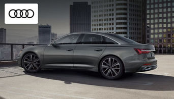 Audi A6 luxury sedan parked outside Audi Dayton, showcasing its sleek executive design 