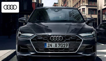 2025 Audi A7 parked outside the Audi Dayton dealership, showcasing its modern luxury design 