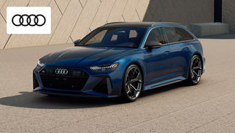 The Audi RS6 Avant is in motion on a highway in Dayton, OH, showcasing its sleek estate design and performance stance. 