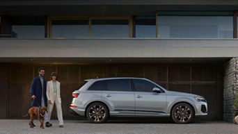 Front view of the 2025 Audi Q7 parked in front of Audi Dayton showcasing its elegant grille and modern design. 