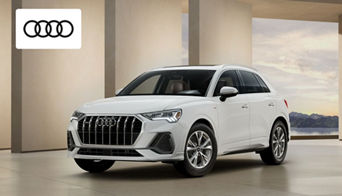 New Audi SUVs and sedans for sale at Audi Dayton near Dublin, Ohio dealership showroom. 