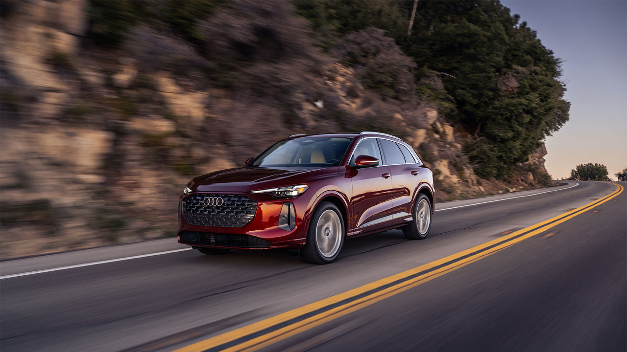 Side view an Audi Q5 accelerating.