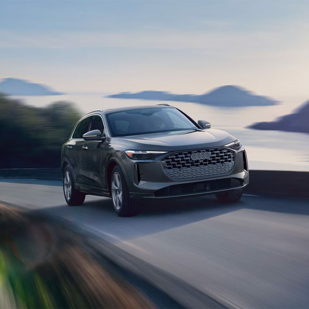 Front profile view of an Audi Q5 accelerating.