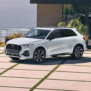Side view of an Audi Q3 parked.