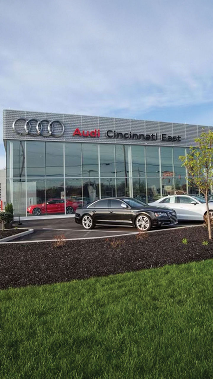 Left side profile view of an Audi S6 parked.