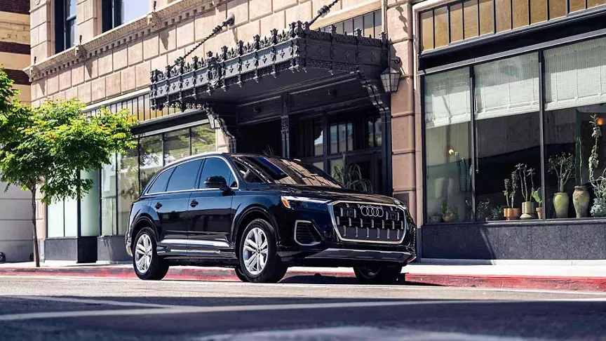 Three quarter view of an Audi q7 vehicle parked.