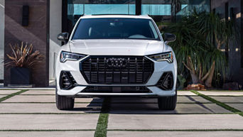 Center profile of an Audi Q3 accelerating.