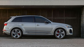 Front facing view of an Audi Q7 accelerating.