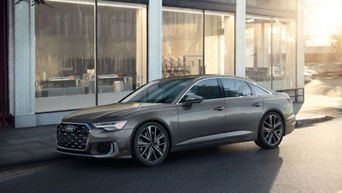 Front facing view of an Audi Q7 accelerating.