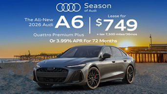 Left side profile of an Audi A6 accelerating.