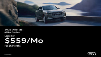 Three quarter view of an Audi Q5 driving.
