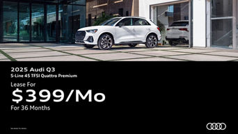 Three quarter view of an Audi Q3 parked.