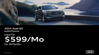 Three quarter view of an Audi Q5 driving.