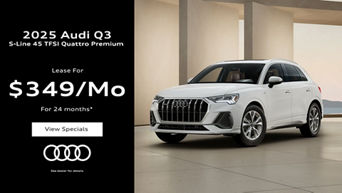 Three quarter view of an Audi Q3 parked.