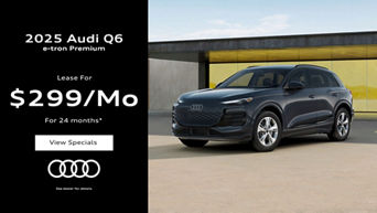 Three quarter view of an Audi Q6 e-tron parked.