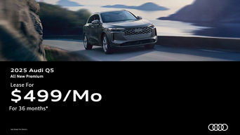 Three quarter view of an Audi Q5 driving.