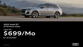 Three quarter view of an Audi Q7 parked.