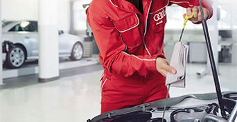 Service technicians changing oil.