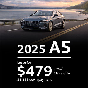 Side view of an Audi Q3 driving.