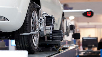 Car wheel on alignment machine.