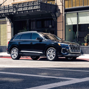 Side view of an Audi Q7 driving.