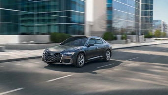 Side view of an Audi A6 driving,
