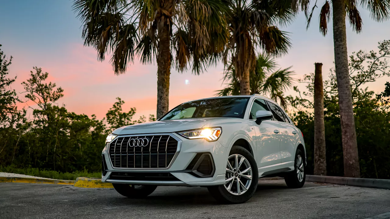 Three quarter view of an Audi q7 vehicle parked.