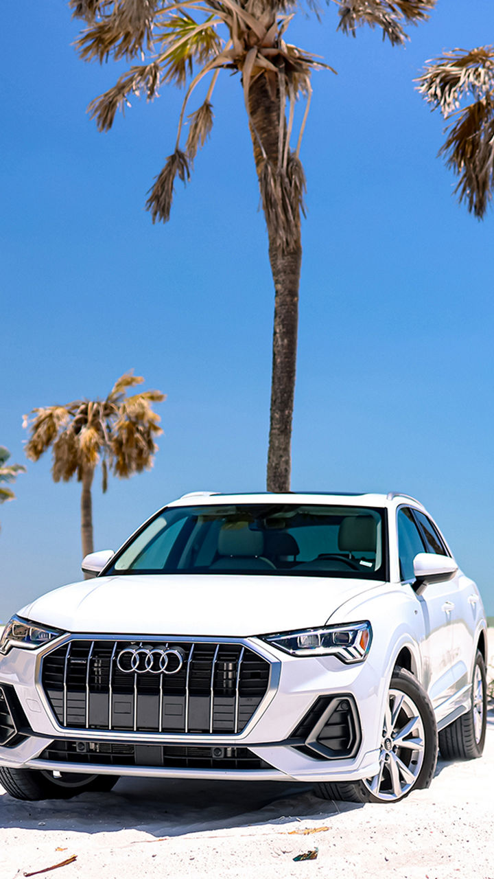 Audi 2025 Audi Q6 e-tron left profile driving.