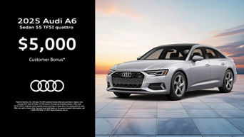 Three quarter view of an Audi A6 parked.