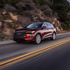 Three quarter profile view of an Audi Q5 accelerating.
