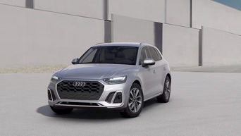 Three quarter profile view of an Audi Q5 parked.