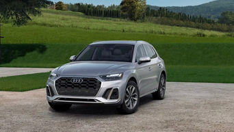 Three quarter profile view of an Audi Q5 parked.