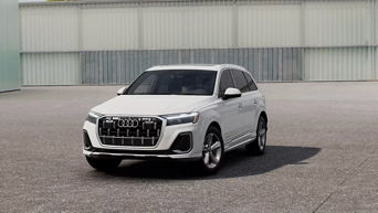 Three quarter profile view of an Audi Q7 parked.